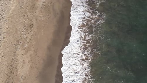 Waves on the beach sand
