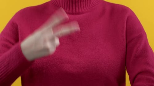 Readout Female Hand Counting From 1 to 3 with Fingers on Yellow Red Background