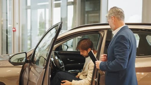 Car Agent and Customer in Car Showroom Man Choosing New Car in Salon Car Dealer