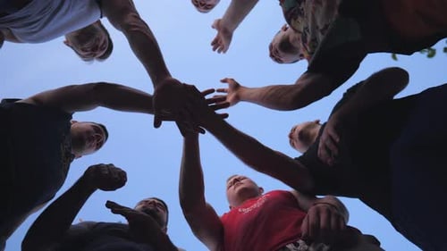 Group of Friends Joining Hands in Unity