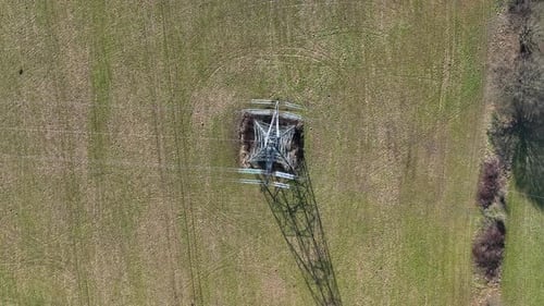 Bird's Eye View of an Industrial High Voltage Lattice Power Line Tower