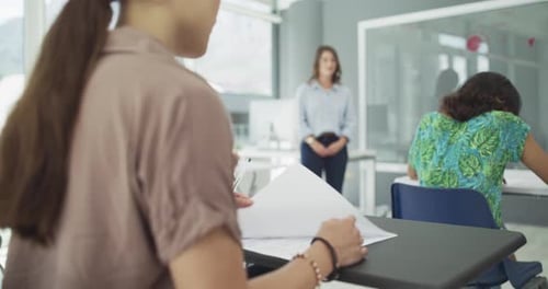 4k video footage of students writing a test in a university classroom