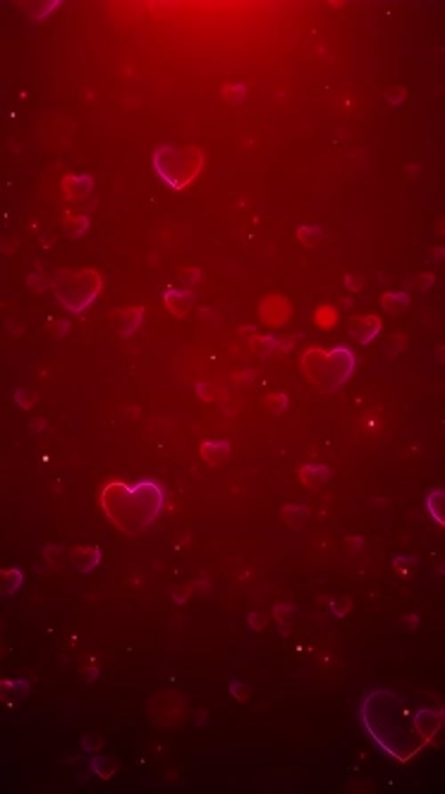 Leuchtende rote 3D-Partikel in Liebesform zum Valentinstag mit explodierenden Hintergründen. Geburtstag zum Valentinstag