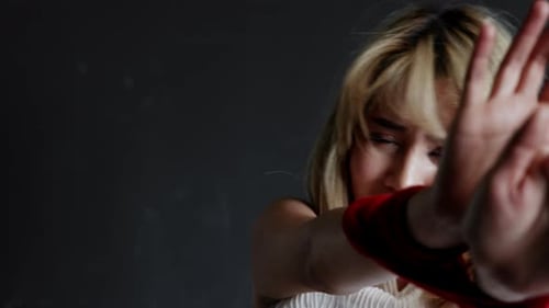 The abducted woman's wrists and feet are bound in red rope, with no way to fight or resist. Female h