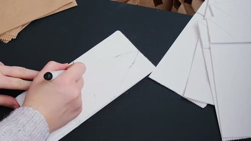 Drawing Designs on Plain Paper Bags with Marker