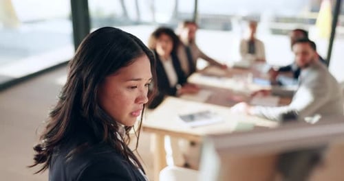 Young Professional Giving Presentation at Conference Table
