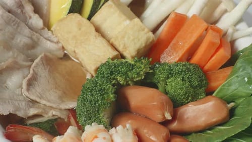 Close Up Of A Bowl Of Sukiyaki Or Shabu Spinning Around In The Kitchen