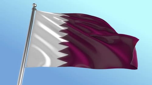 Waving Qatar Flag On Pole Against Blue Sky