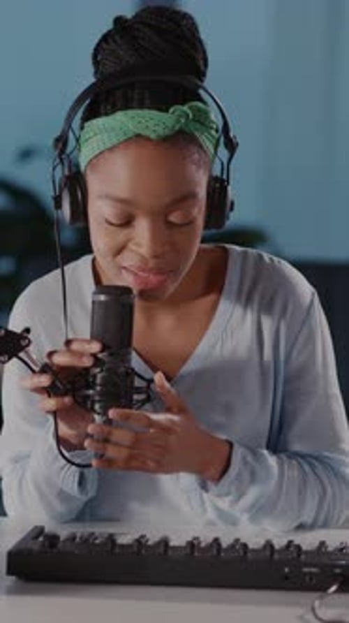 A Woman Creates Music in Her Home Studio Recording Her Passion