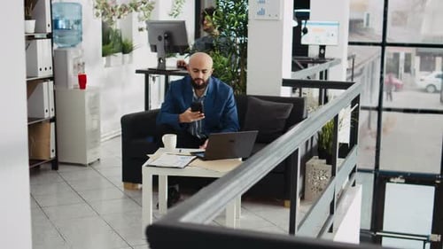 Startup Employee Works on Presentation