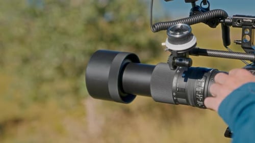 Camera Lens Adjustment on Location Outdoors