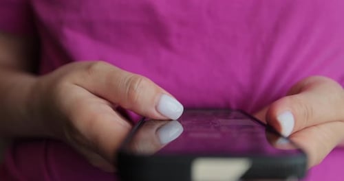 Adult Using Smartphone with Touchscreen Technology