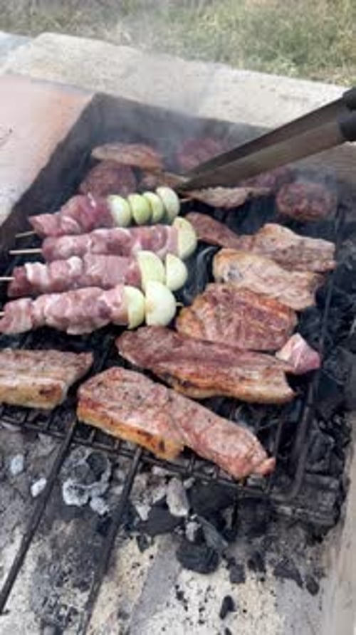 Close Up of Assorted Meats Grilling on BBQ