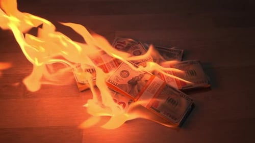 Burning Money on Wood Surface