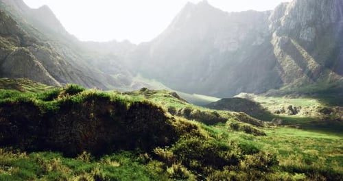 Majestic Mountain Landscape with Lush Greenery and Sunlight Filtering Through