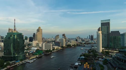 day to night time lapse of Chao Phraya River with King Taksin bridge and building of Bangkok city