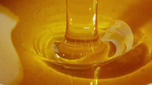 Liquid Gold Pouring Honey in Motion