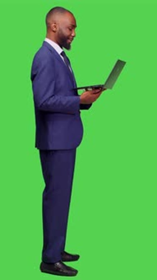 Man in Suit Uses Laptop for Video Call