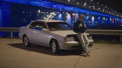 Man By Vintage Car Atmospheric Nighttime Scene Featuring Man and Classic Car Calm City Night with