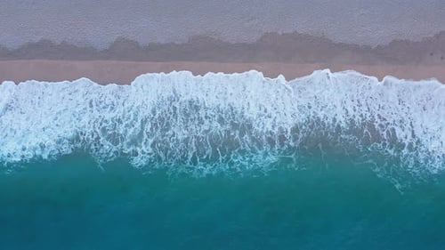 Cold Sea Waves on Sandy Beach