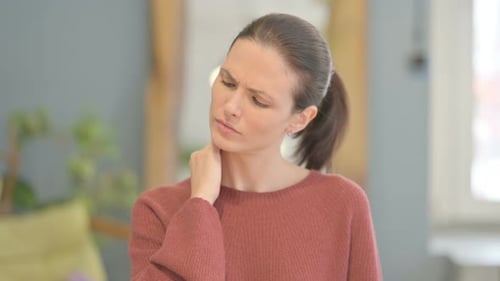 Young Adult Woman Experiencing Neck Pain