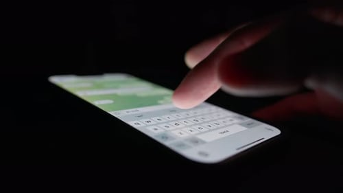 Phone close-up - people communicate using messenger, chat