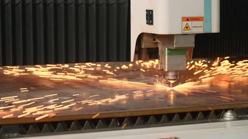 Laser Cutter Machine Precisely Cutting Metal with Sparks