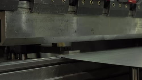 The Employee Hands are Not Bending the Large Parts of the Metal on the Bending Machine Closeup The