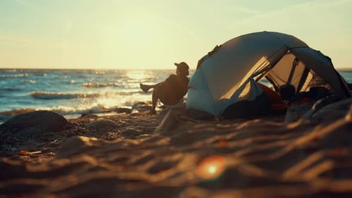 Happy Man Relaxing on Sea Beach Alone Admire Sunset Above Water Local Tourism Backpacking and