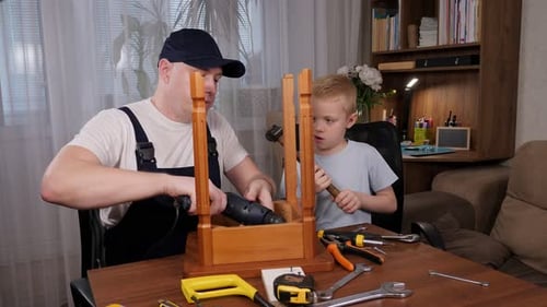 Man and Child Working Together on Furniture Project