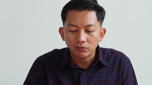 Man Eating Food and Drinking Water Indoors