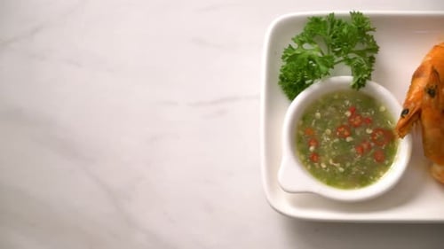 Delicious Cooked Shrimp on Plate with Dipping Sauce