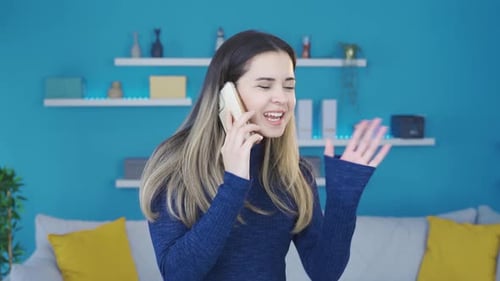 Young Adult Talking on Phone Indoors