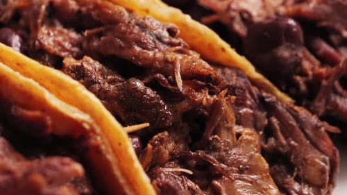 Close-up of Delicious Tacos with Shredded Meat and Beans
