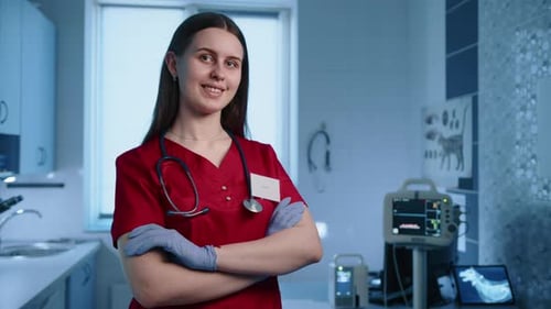 Close Up of Smiling Female Young Veterinarian in a Modern Animal Hospital