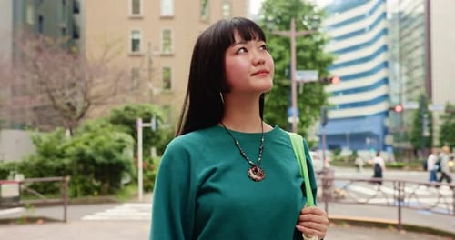 City, thinking and walking with Japanese woman outdoor for holiday, travel or vacation abroad