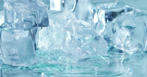 Ice Cubes Getting Water Poured On Them