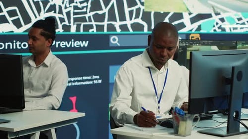 African American Agency Employee Gathers Data for Order Tracking