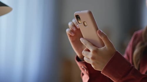 Student Hands Swiping Smartphone in Apartment Closeup Woman Browsing Internet