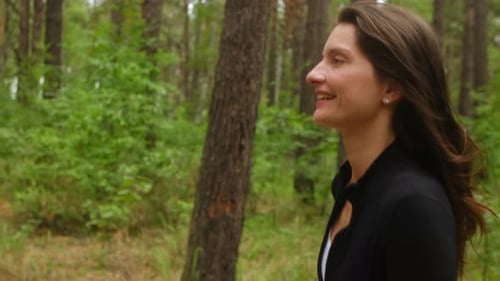 Woman Running in Forest Enjoying Nature and Exercising