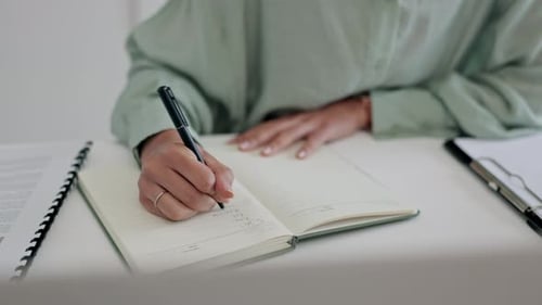 Business person, hands and writing, planning or brainstorming ideas in notebook for marketing