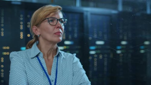 In the Modern Data Center: Portrait of Beautiful Female IT Technician Working With Touch Screen Dev