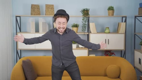 Lively man having fun, dancing at home.