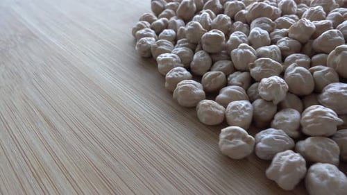 Close up Footage of Dried Chickpeas on Wood