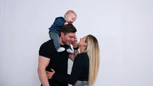 Loving Family with Baby on Father's Shoulders