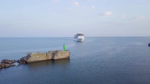 Aerial view of large white cruise liner Seven Seas Splendor arriving at the port of Liepaja (Latvia)