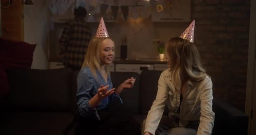 Friends Celebrate Birthday with Treats and Festive Hats