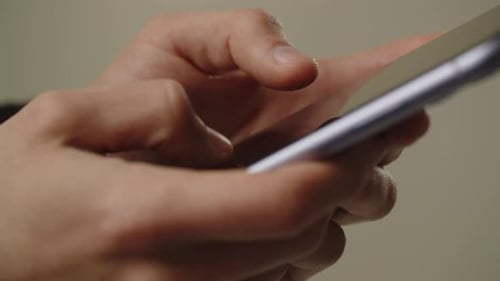 Hands Using Smartphone Close Up