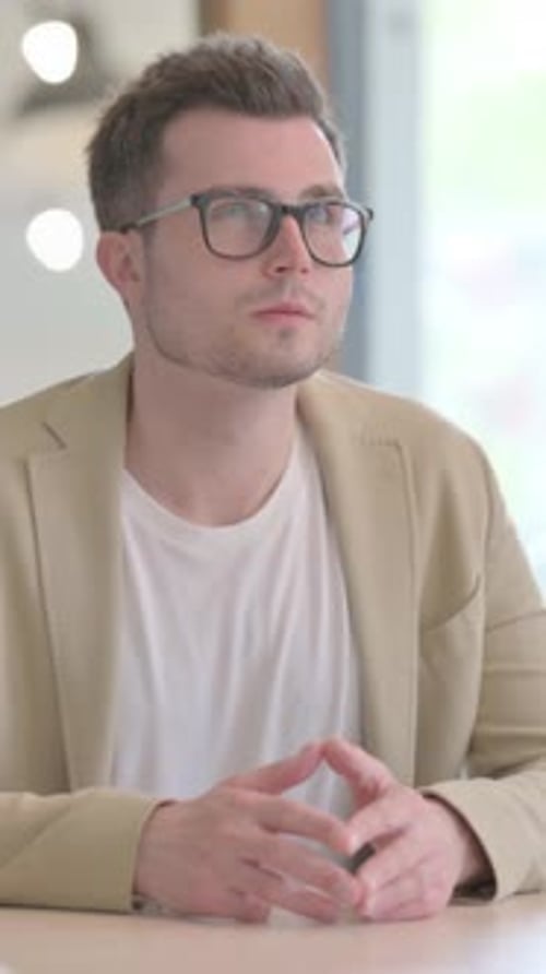 Thoughtful Young Businessman Thinking of New Idea, Vertical Video