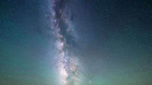 Dramatic Night Sky with Milky Way and Meteors